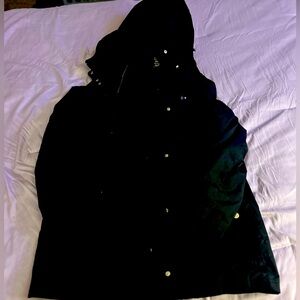 Black coat with a hood. Goes right before the knees. Size 3X.